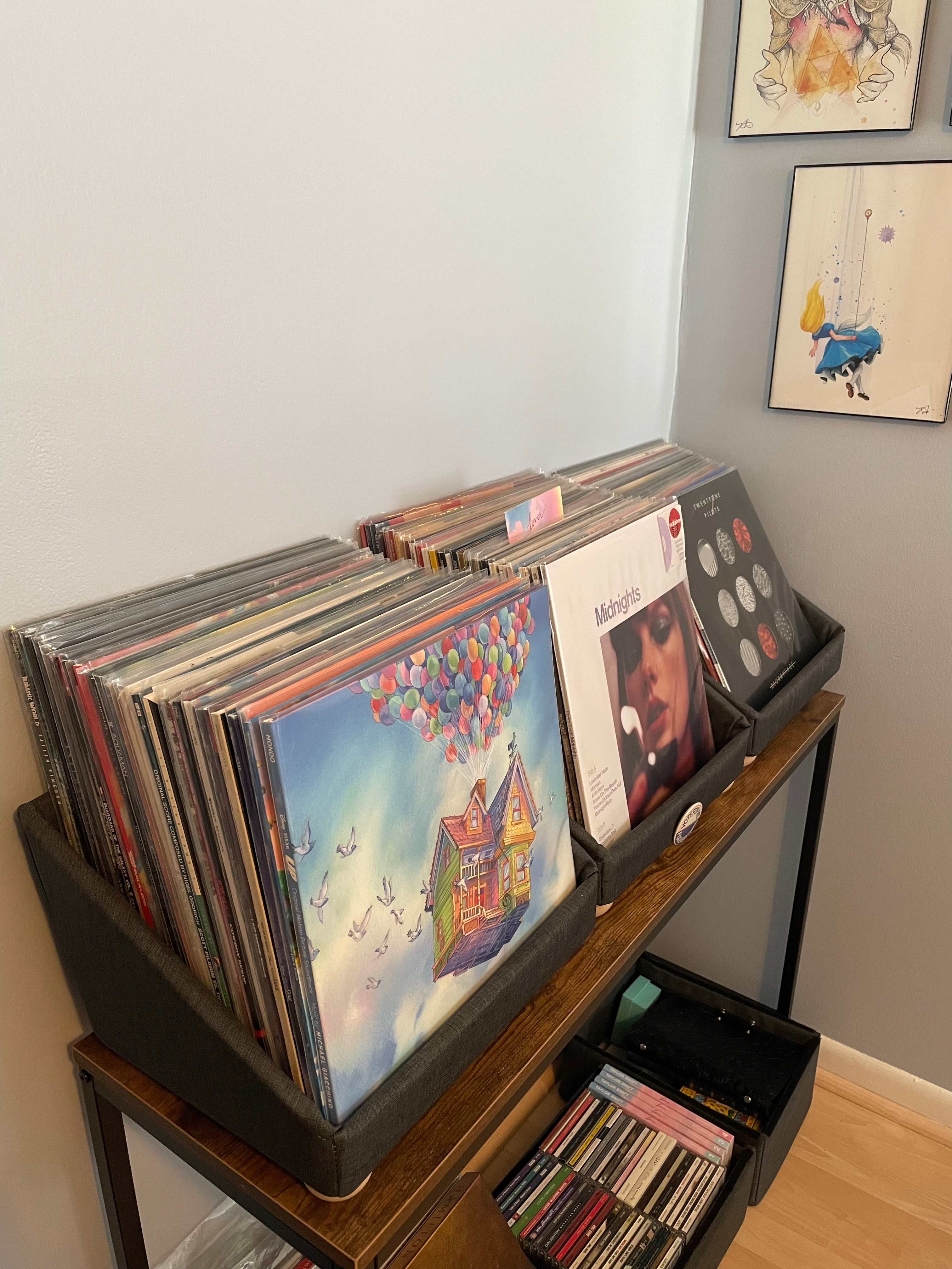 Vinyl albums arranged for browsing in tabletop storage containers